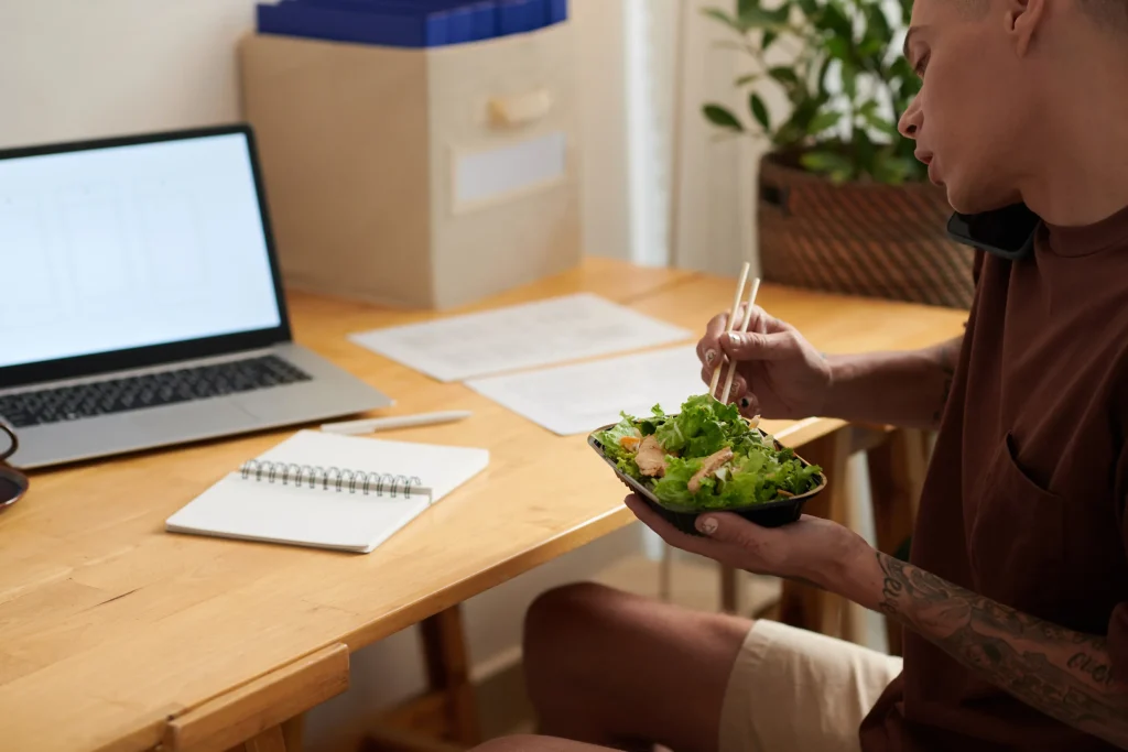 man eating salad for lunch